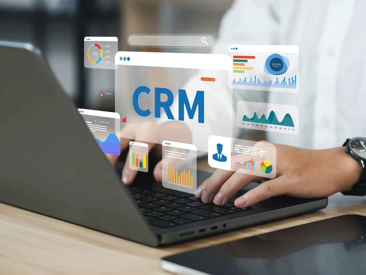 Person using CRM software on laptop to automate customer follow-ups