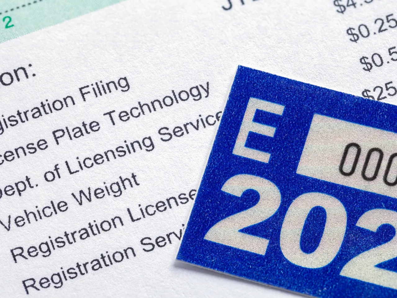 Vehicle registration document and 2023 sticker representing DOT compliance tracking