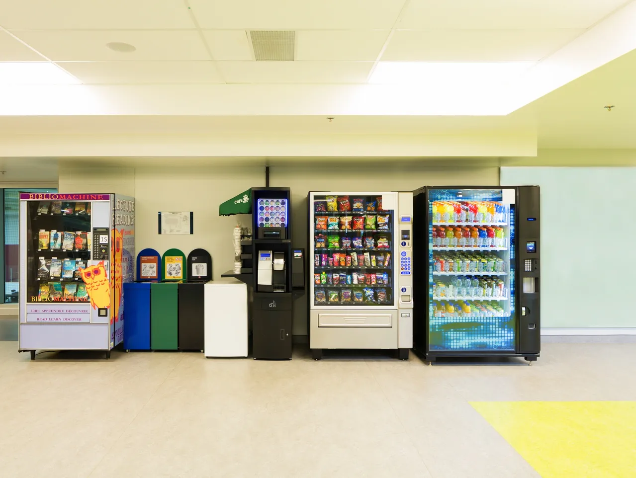 Vending machines and recycling bins in hallway tracked with RenewAlert vendor management software