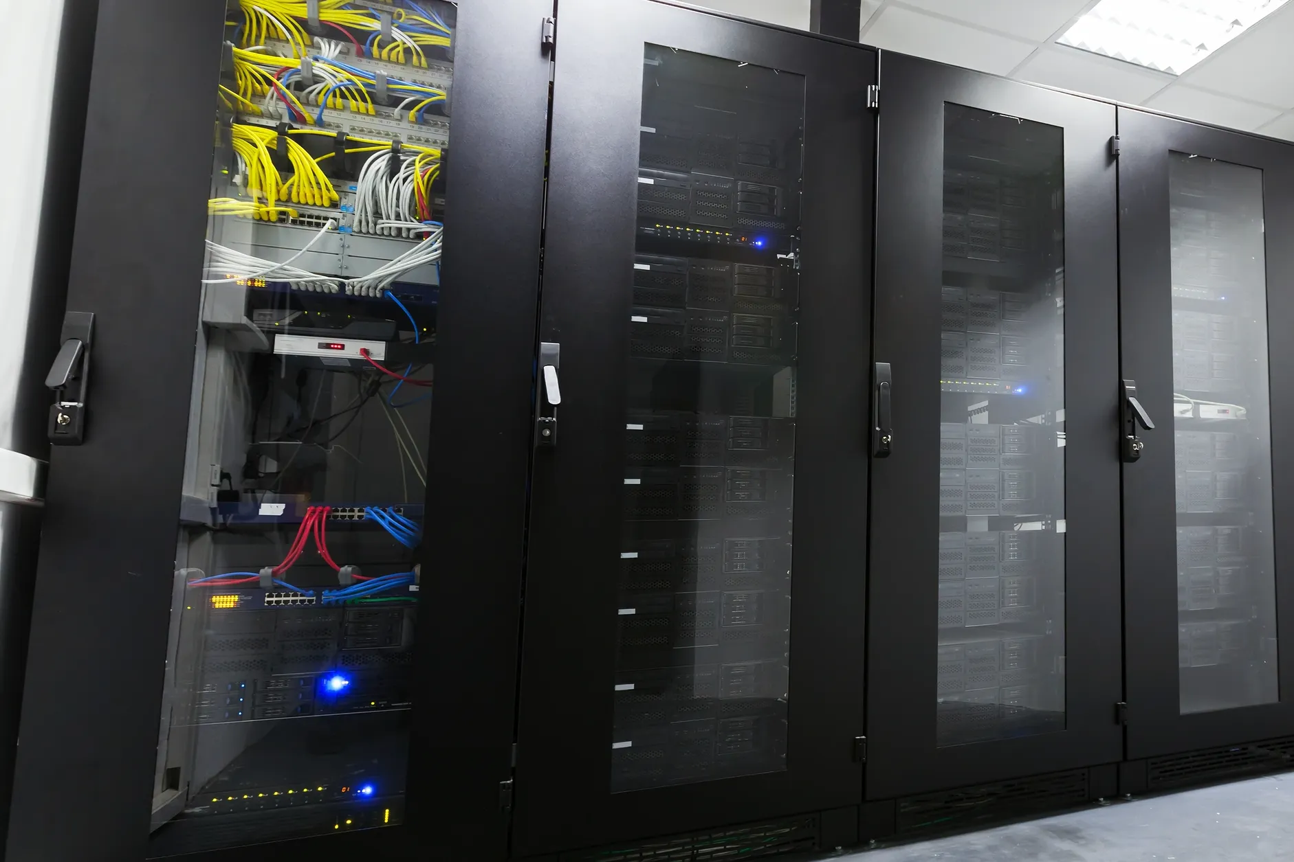 Server cabinets representing Titan-8 IT asset management tracking hardware and software across locations